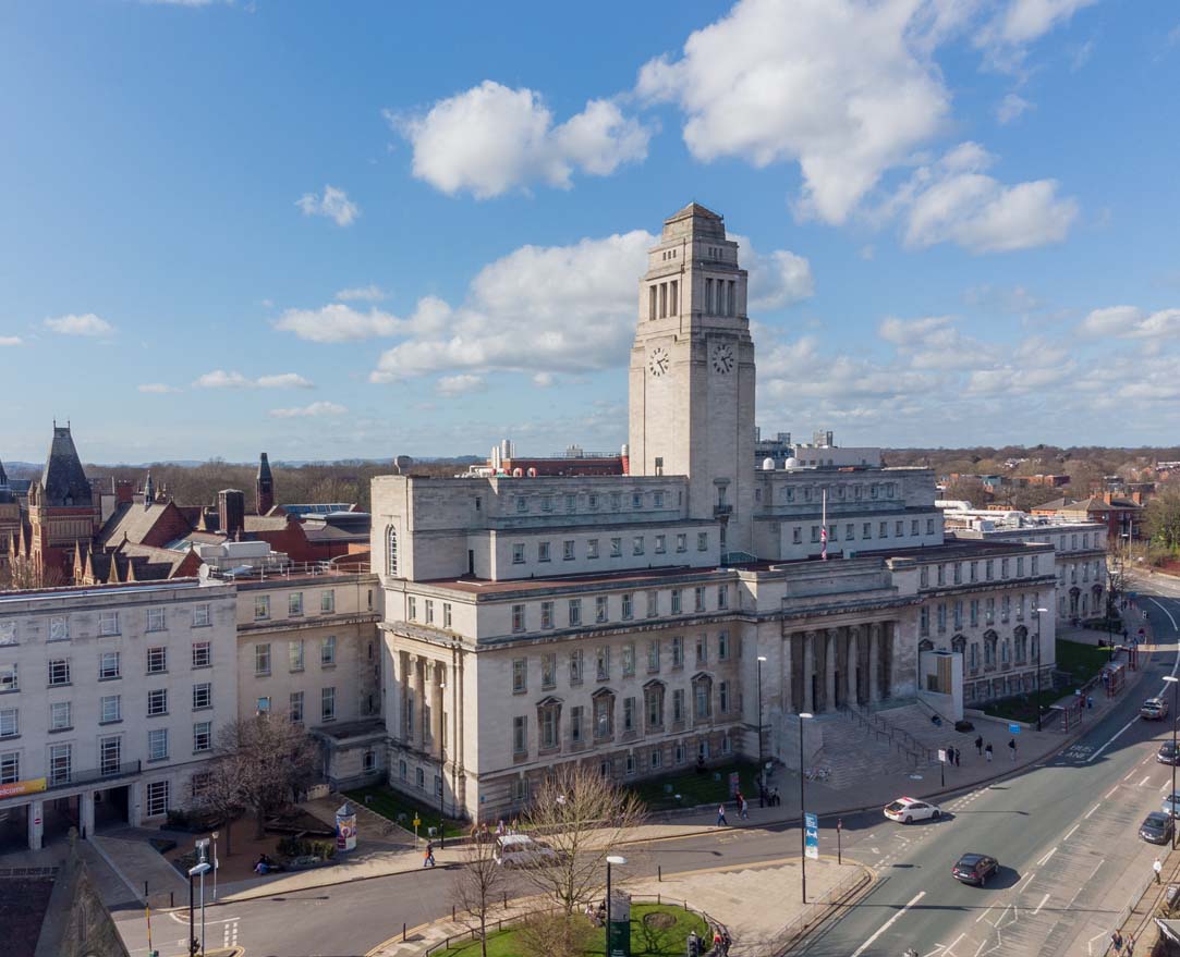 A photo of the University of Leeds Parkinson Building (the main entrance o the university) on a quiet and sunny day.